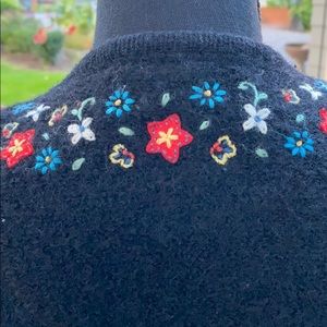 A lovely wool sweater with hand stitching ❣️